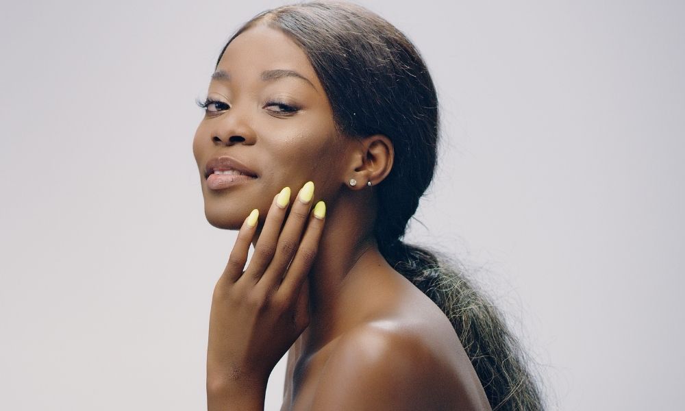 African American Female satisfied with smooth skin